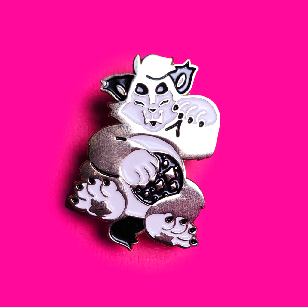Tiny Teeth gold-plated Welcoming Wolf enamel pin